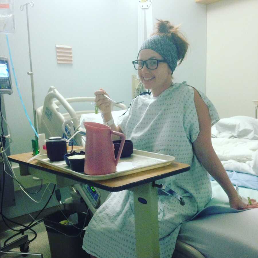woman eating hospital food during her fight with cancer