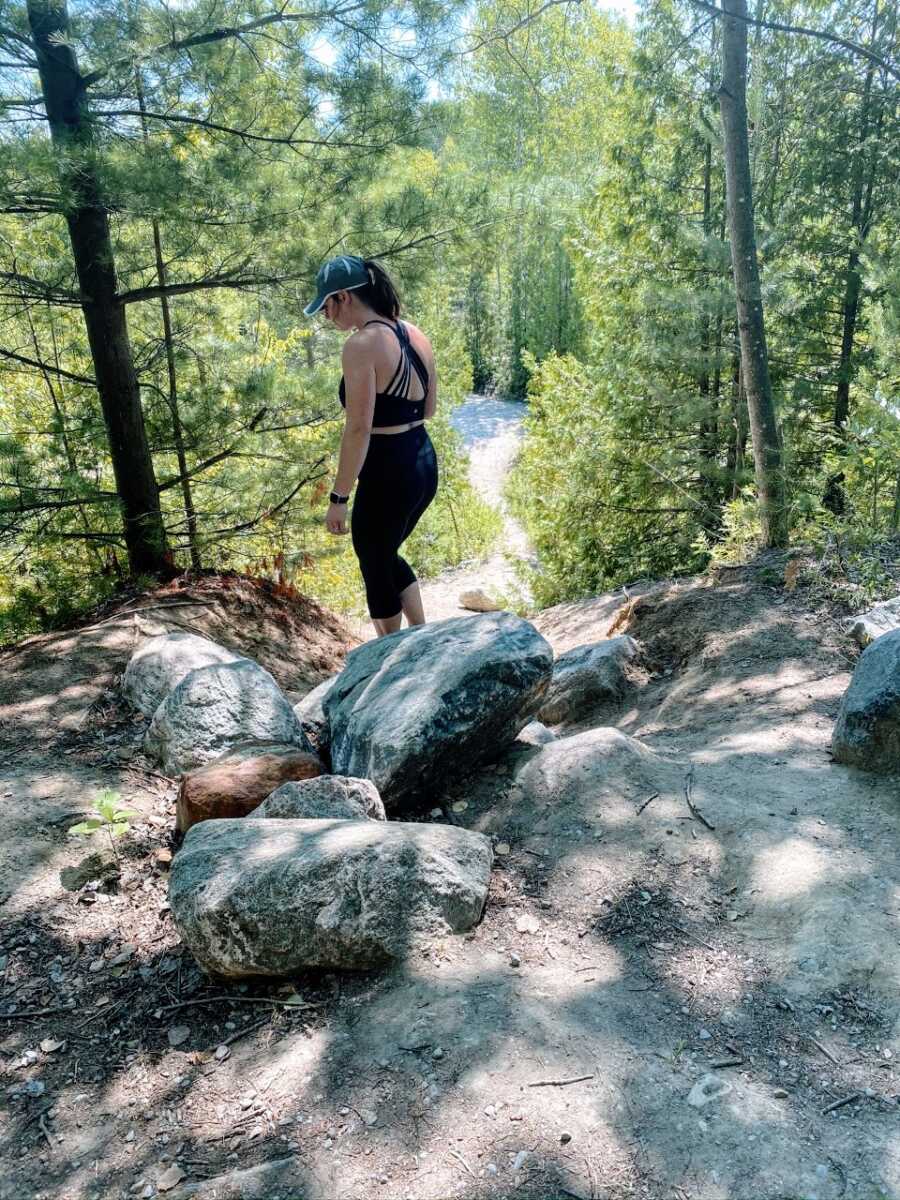 Mom of four enjoys a hike in the woods without her kids