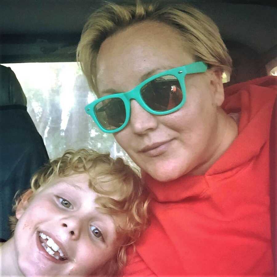 mom in green sunglasses in selfie with son