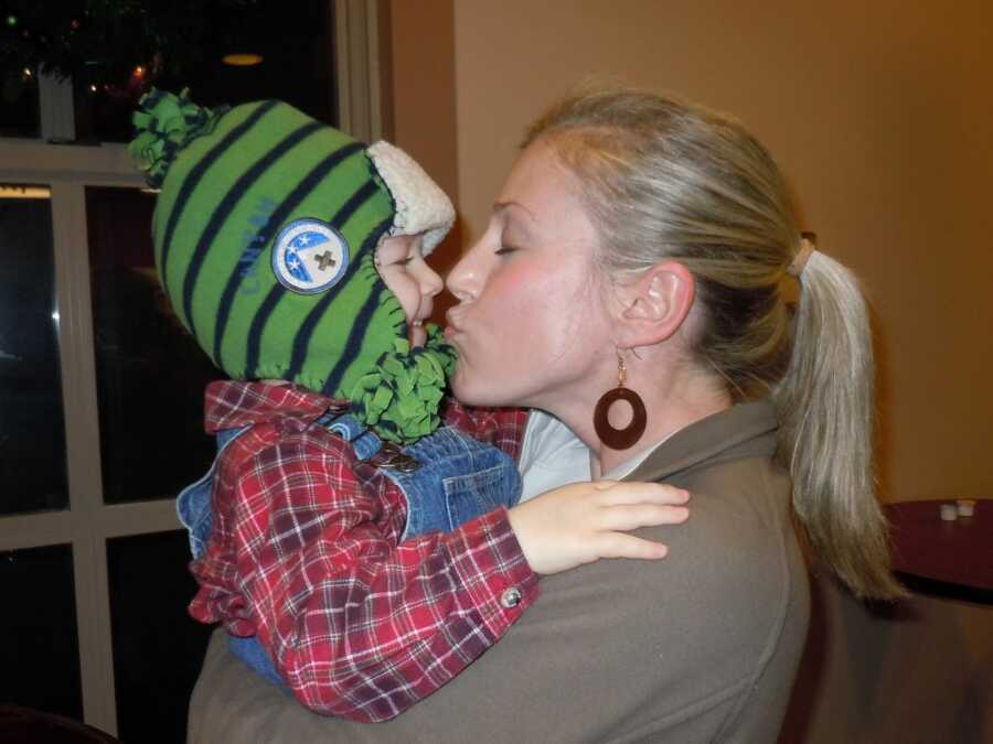 moving giving her son a kiss