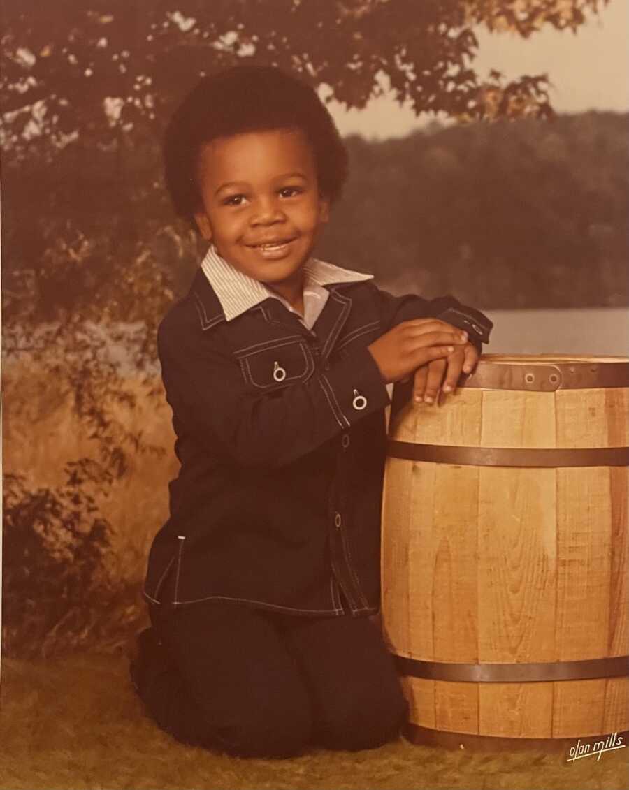 young boy posing for picture