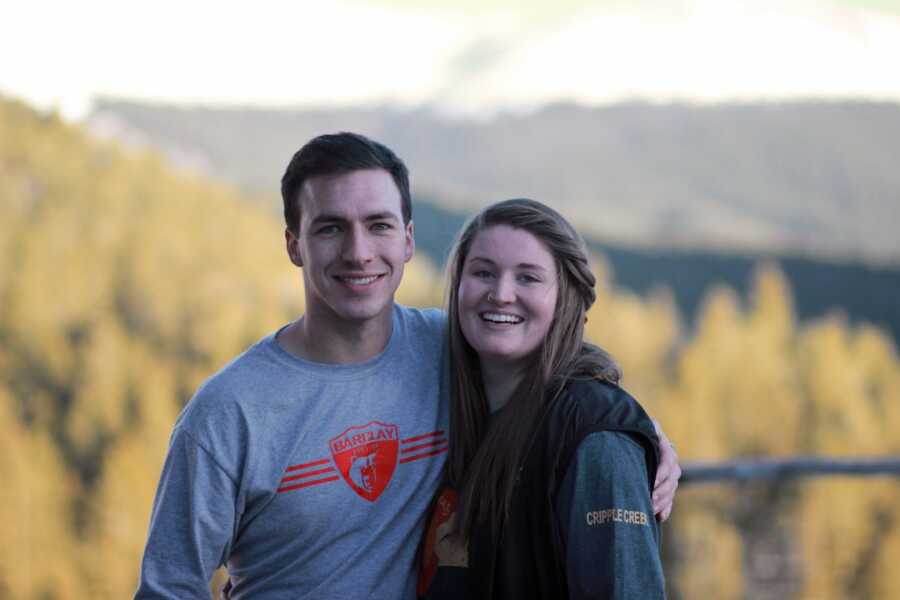 man and woman smiling for picture 