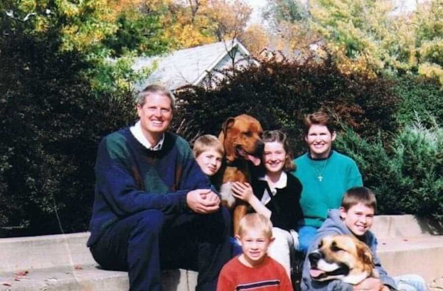 mother and father with children and dog 