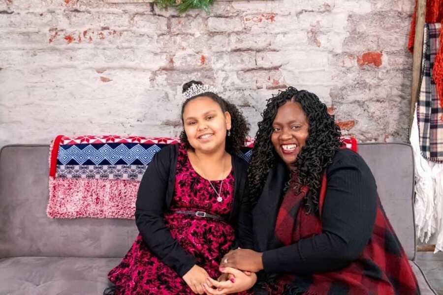 mom and daughter posing for photo