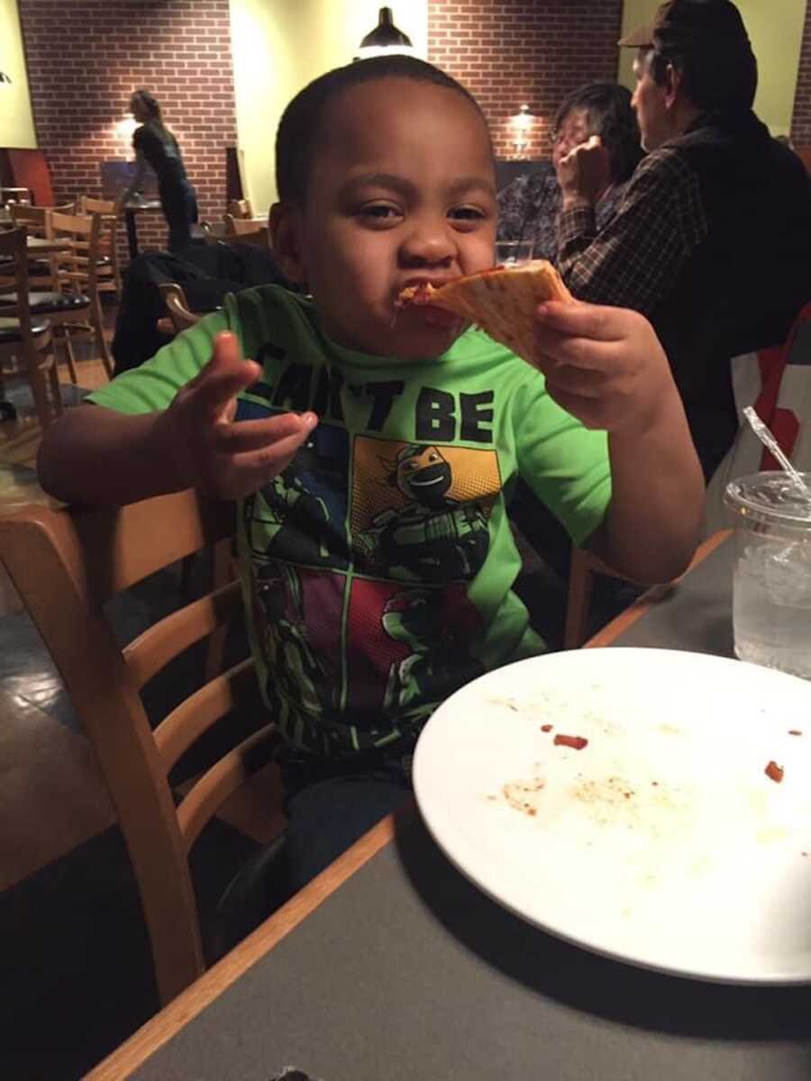 boy eating pizza