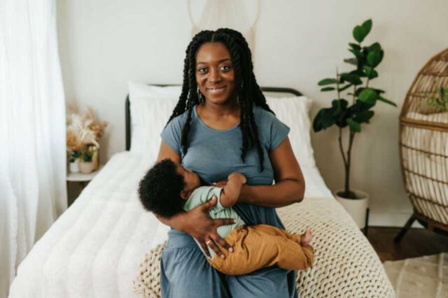 mom holding her child and feeling refreshed