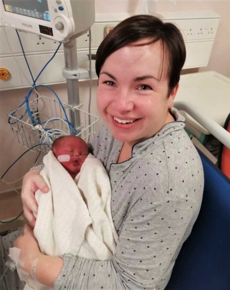 mom with her new daughter with down syndrome