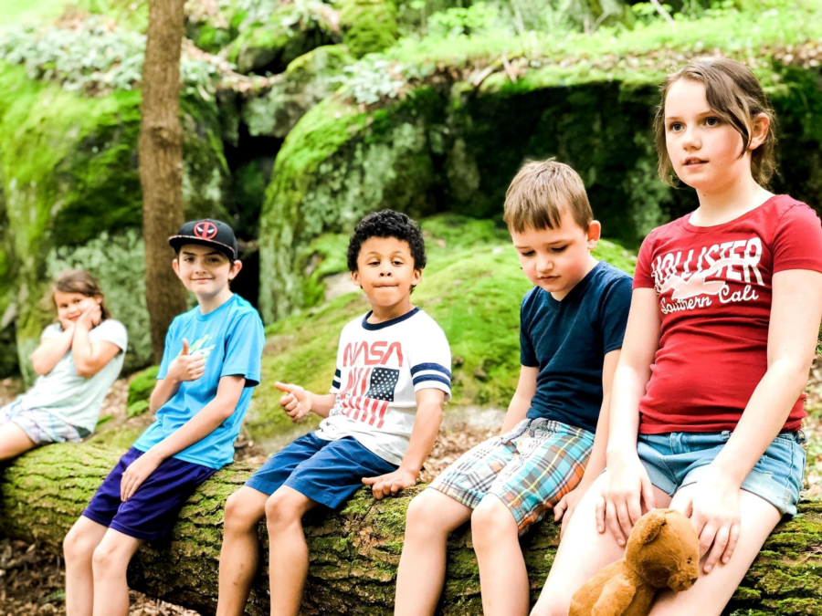 siblings posing together for a photo on a hike