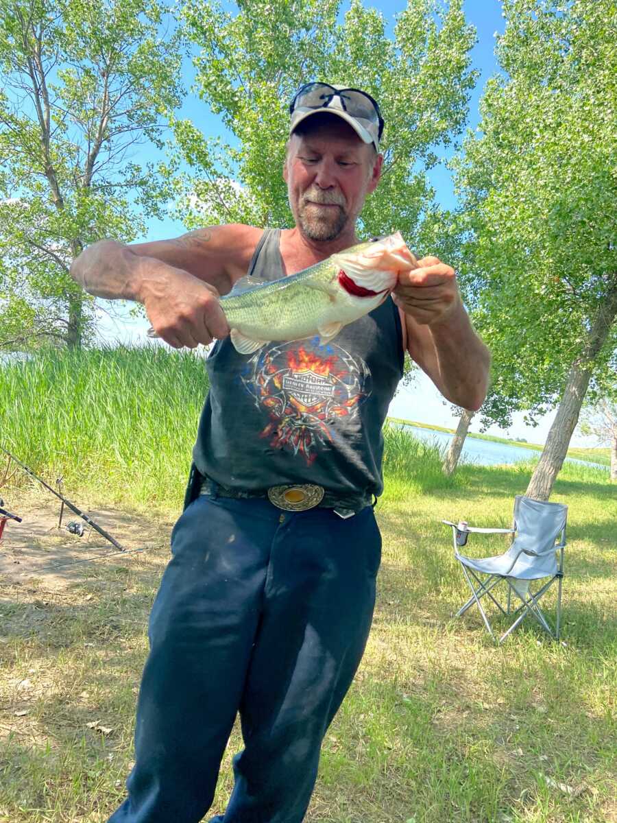 dad with his fish that he caught