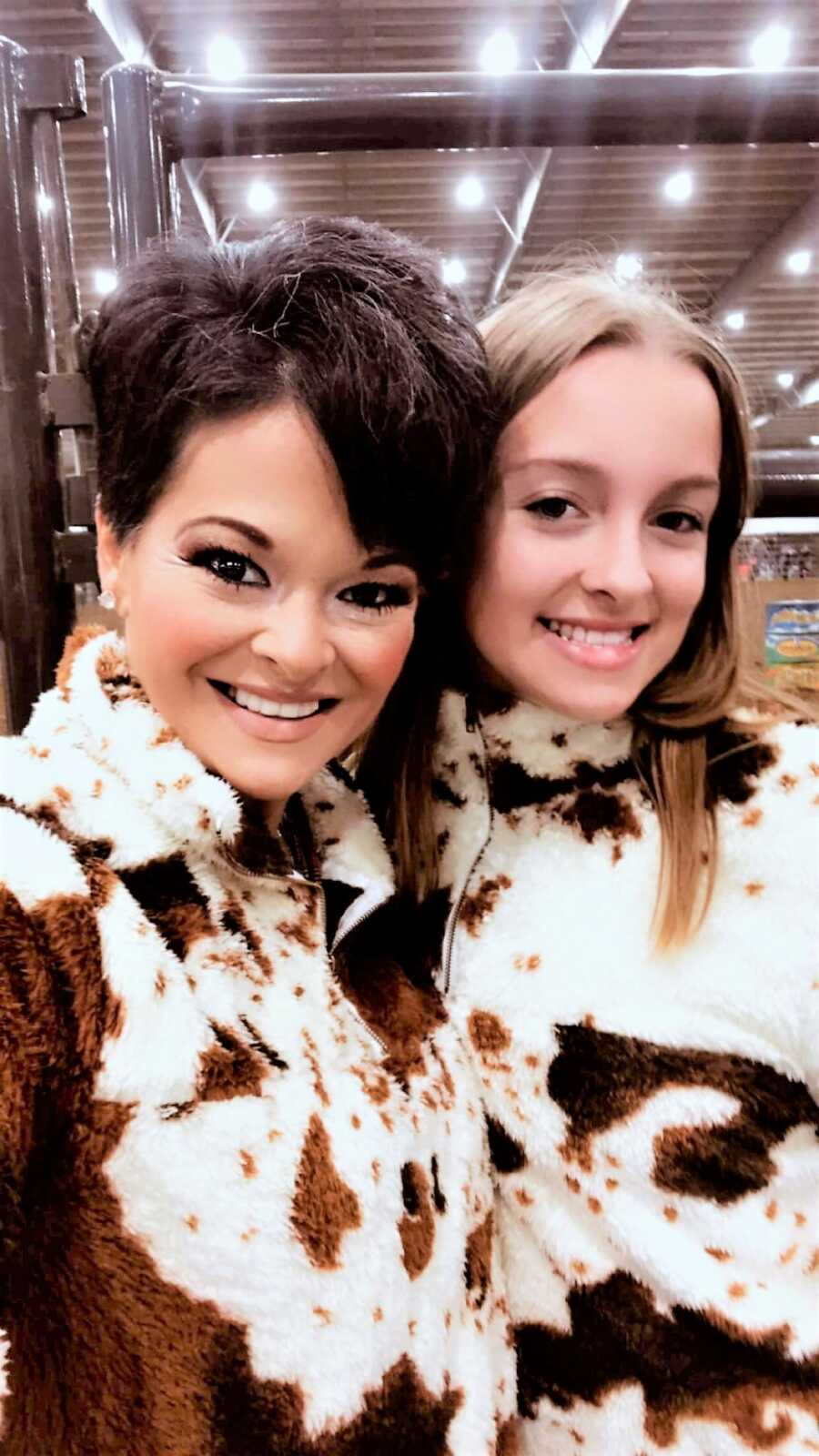 selfie of mother and daughter wearing matching sweaters