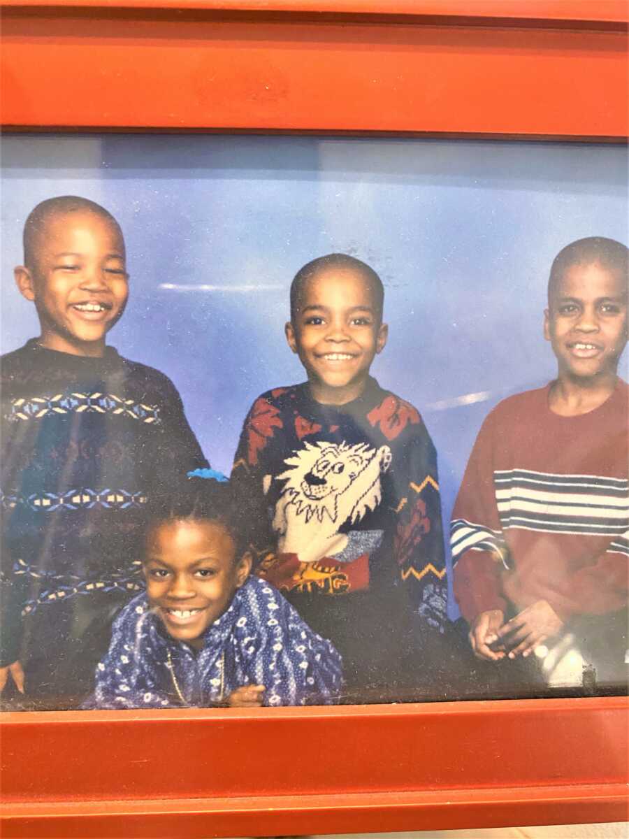 portrait of four young black siblings 