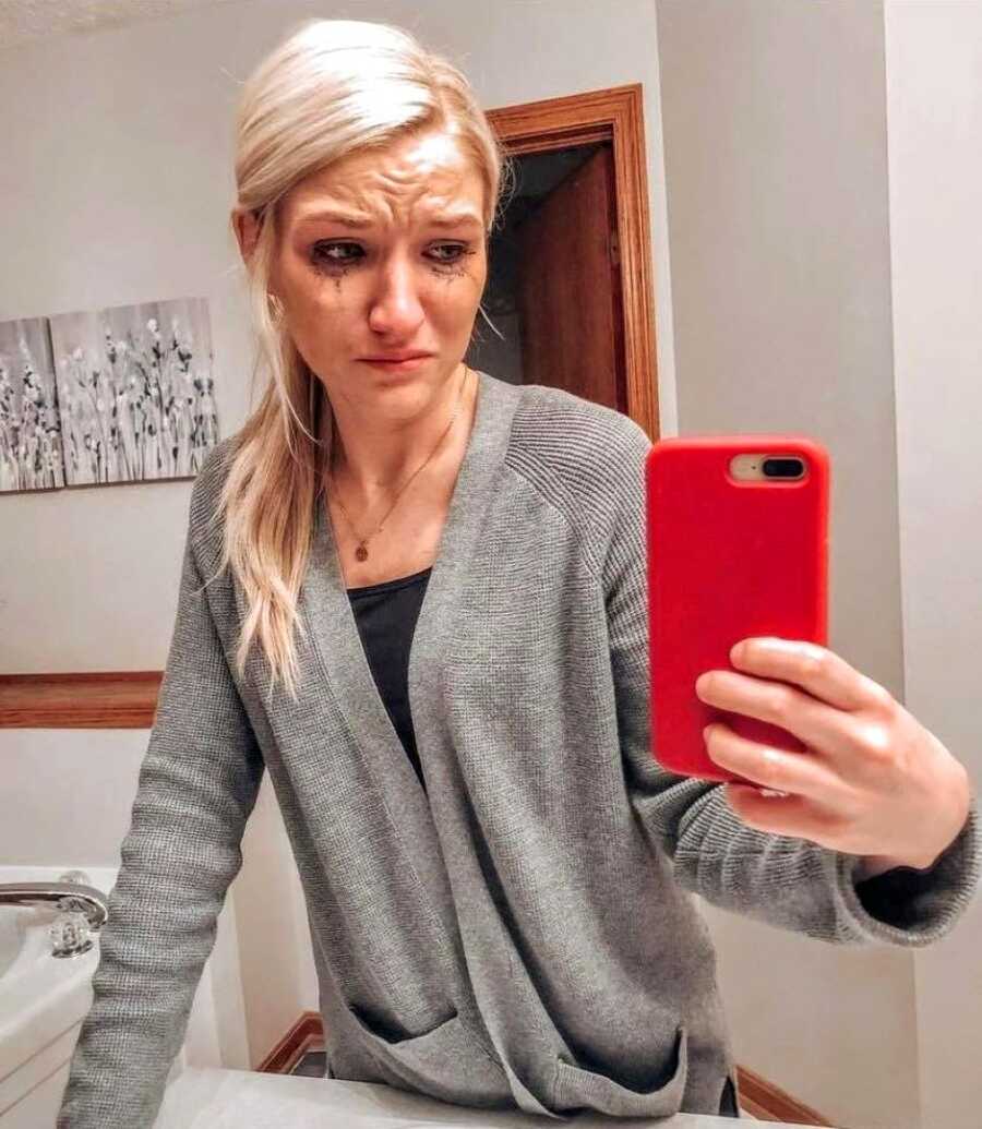 Woman battling infertility takes raw photo crying after long day