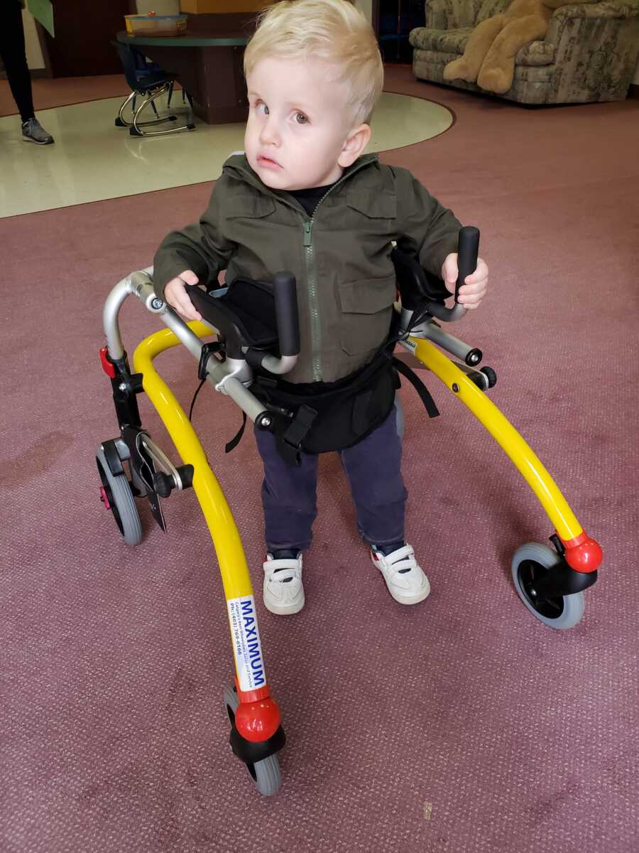 son with blindness learning to walk