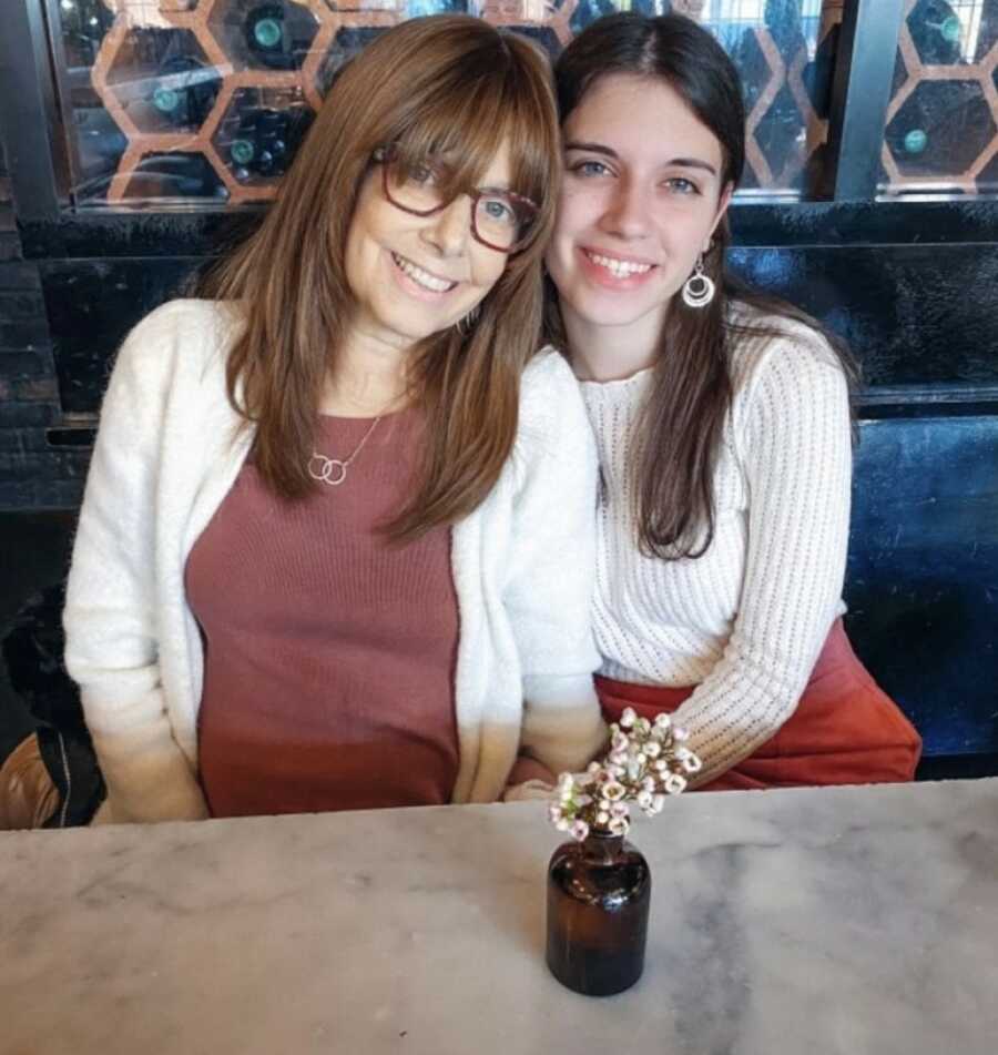 mom and daughter eating at a restaurant 