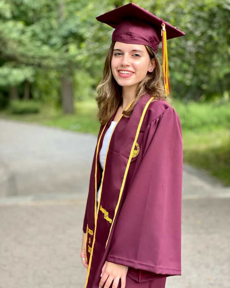 daughter at her graduation alone