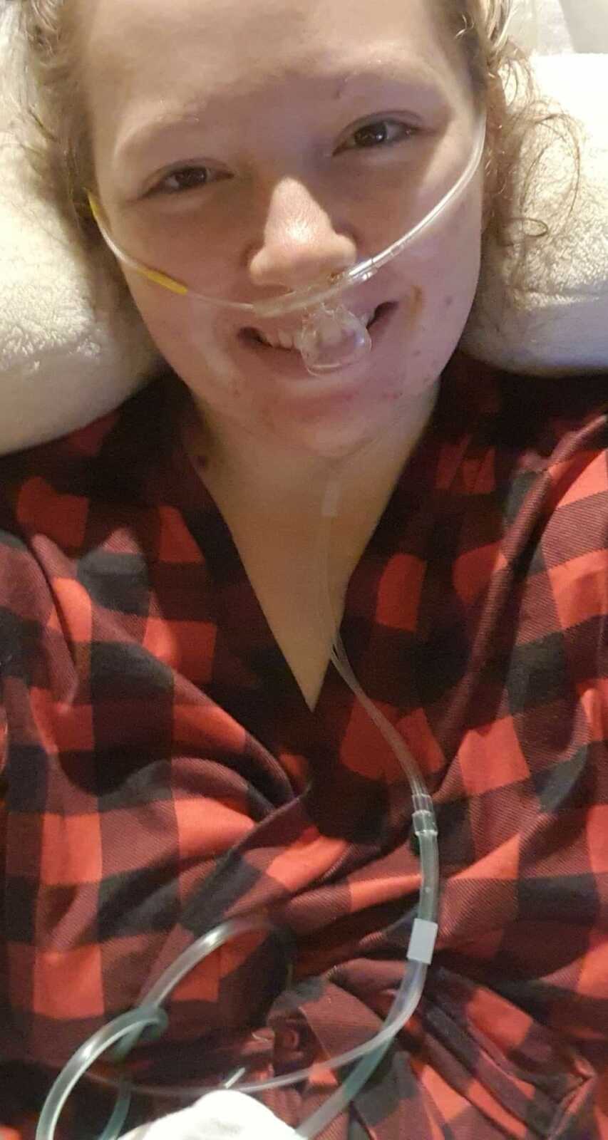 woman smiling in the hospital after surgery