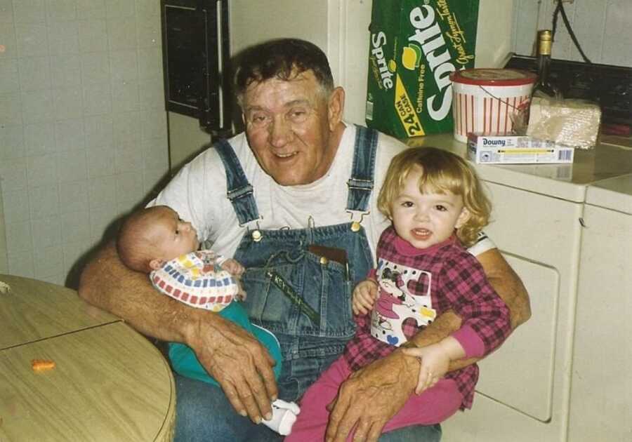 grandpa holding his grandchildren