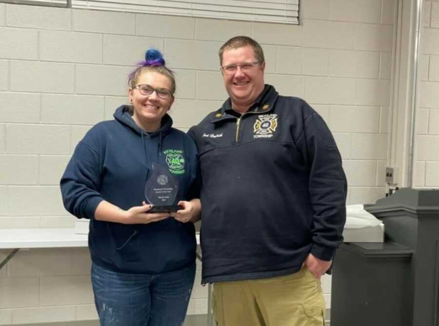 woman receiving an emt reward