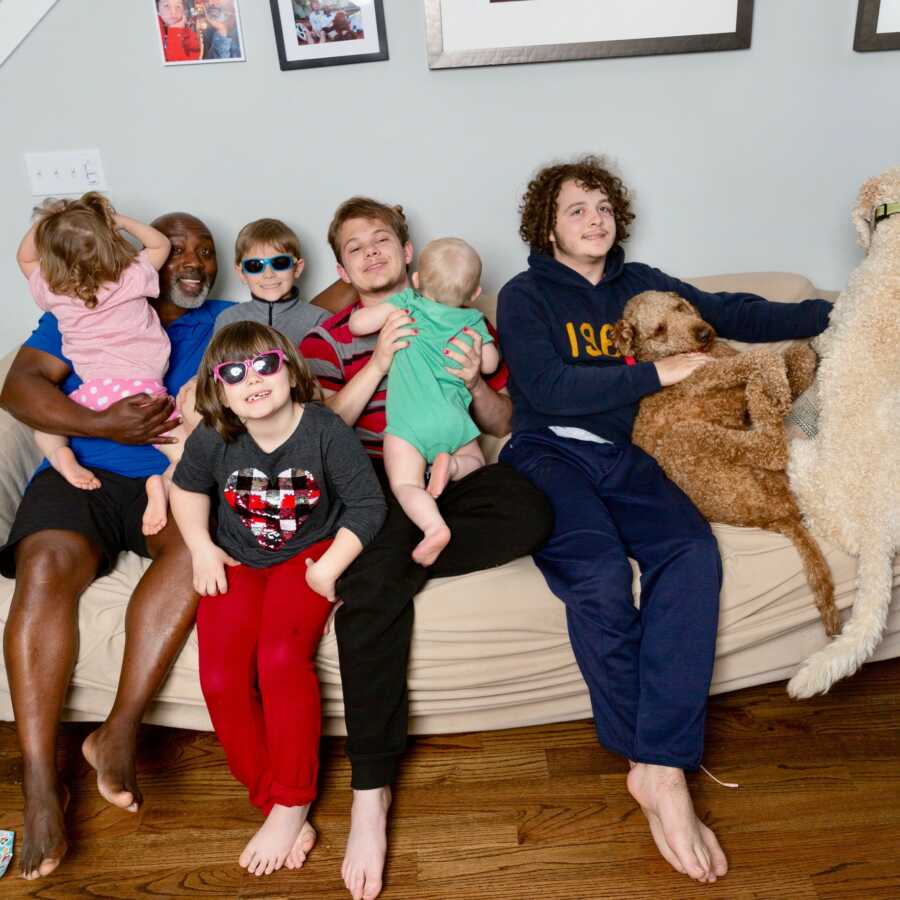 dad and foster children with their dog