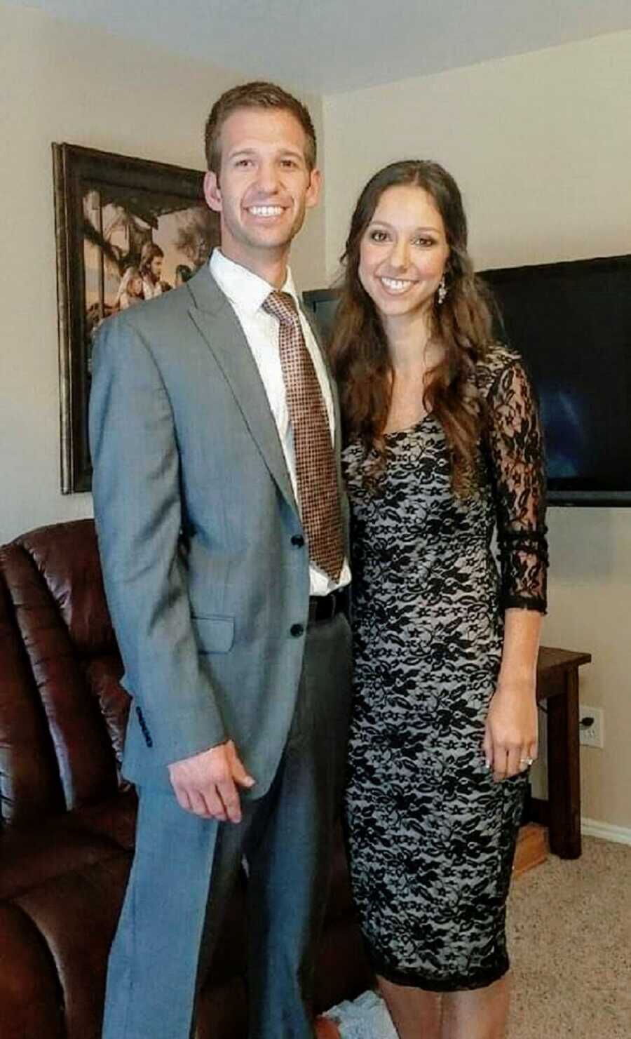 A woman and her husband together dressed up for an event