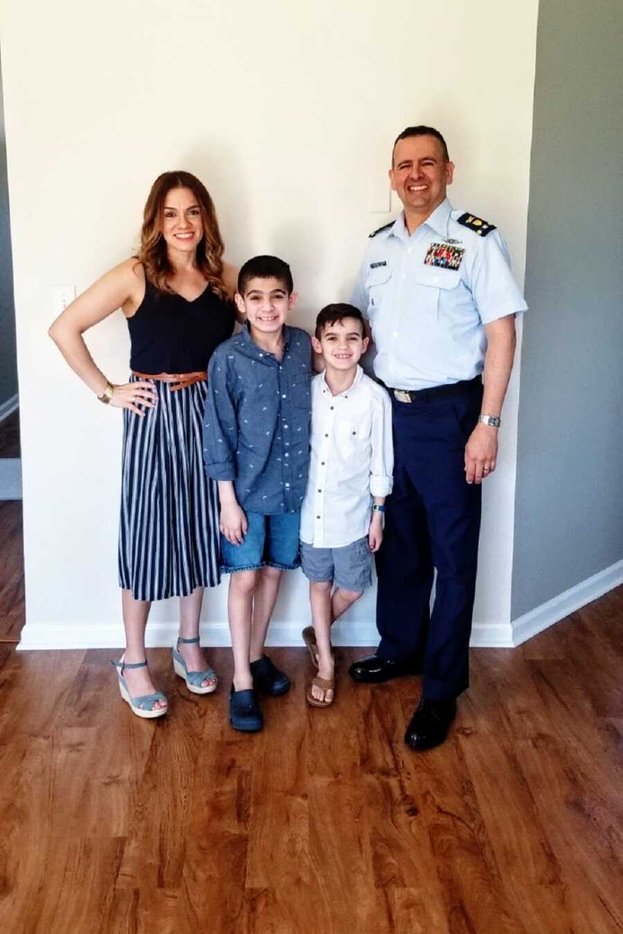 An autistic boy with his parents and little brother