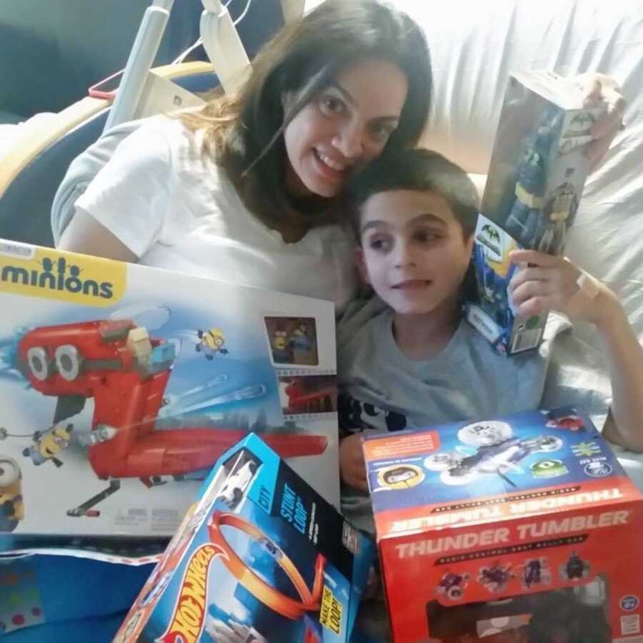 A little boy in the hospital with his mom after a seizure