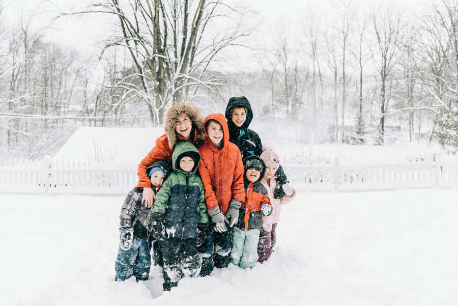 mom with children outside in the snow