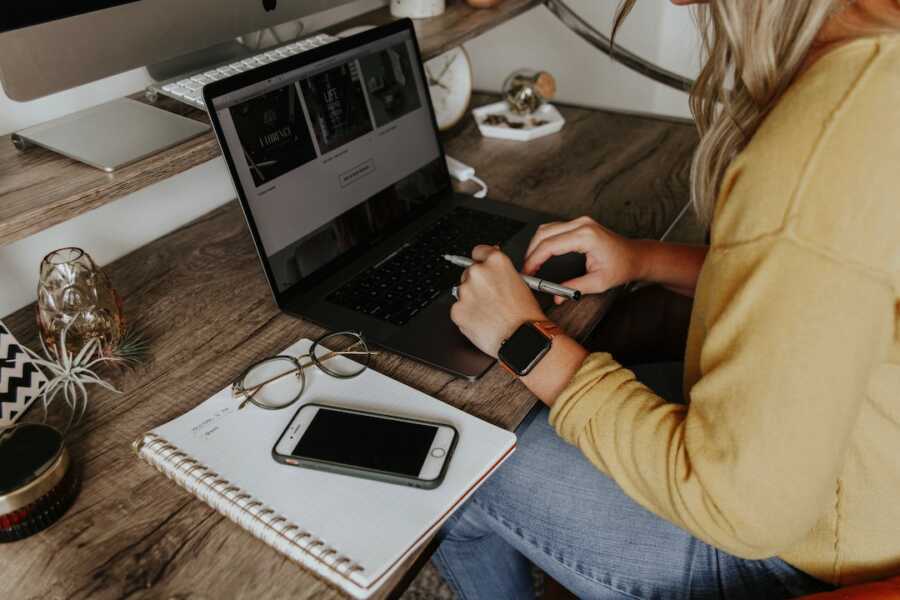 woman sits at her desk working