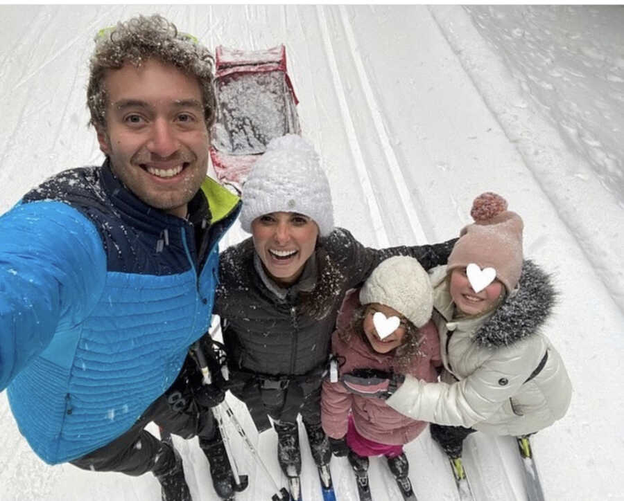 foster parents skiing with two of their foster children