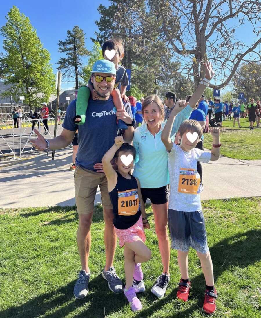 foster parents with three of their foster children after running a race