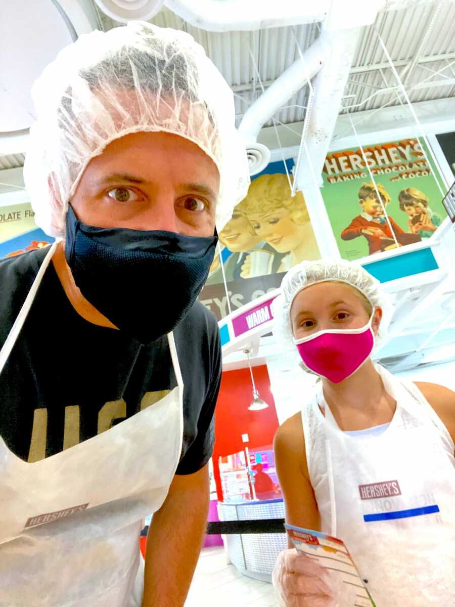 single father takes a selfie with his daughter at Hershey's factory