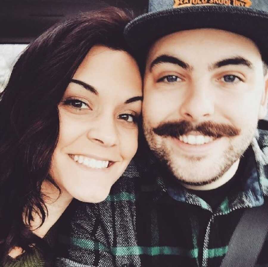 Couple takes selfie together on date.