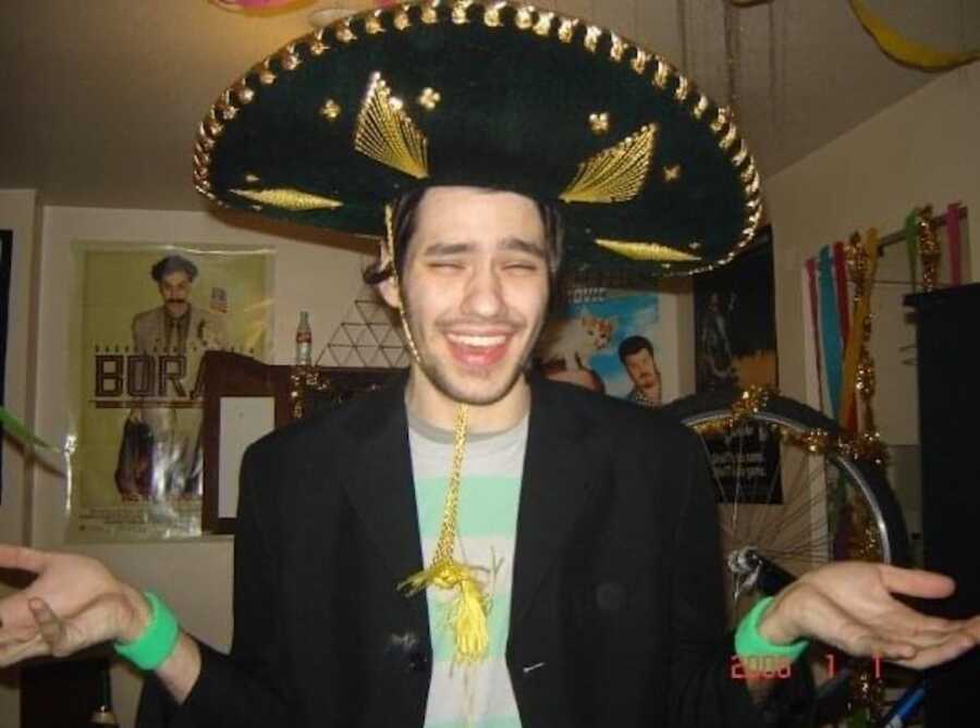 man smiling with sombrero on 