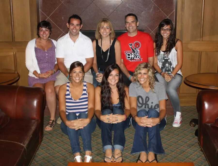 Family sitting together smiling 