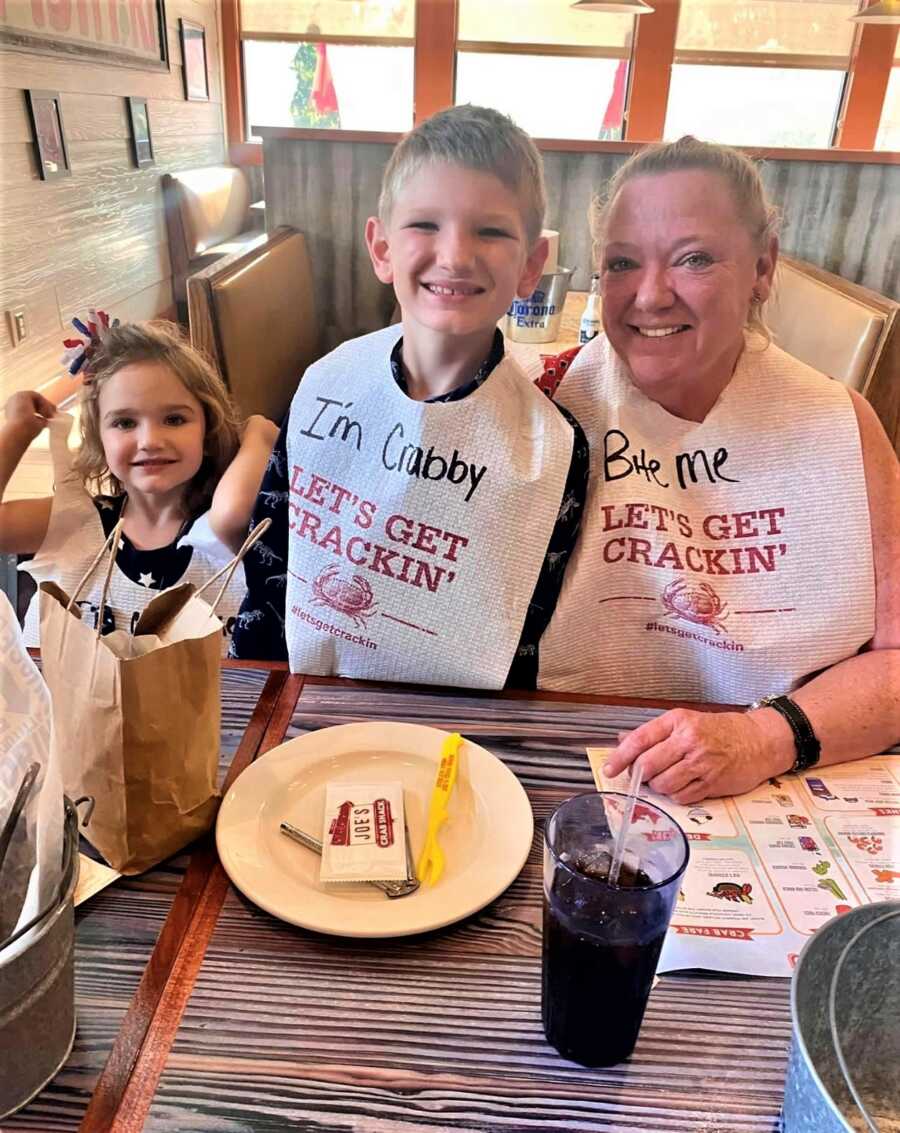 grandma and grandkids out to eat lobster
