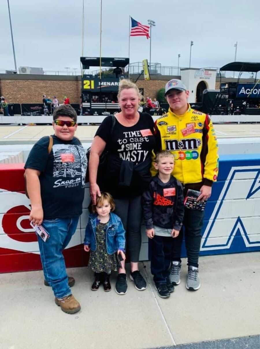 grandparents with their grandchildren at the race track