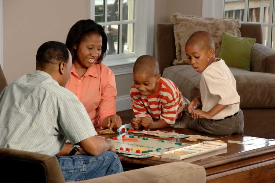 family sits together for a game night