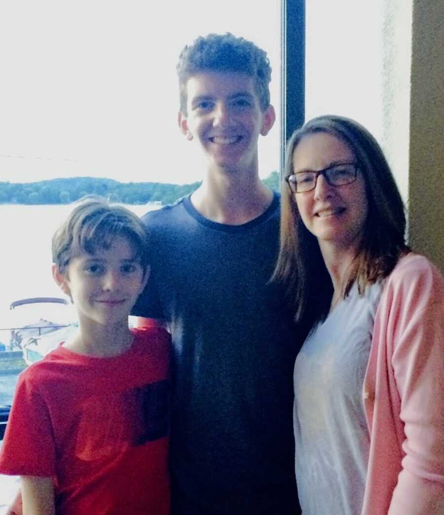 mother with lyme disease stands with her two sons, and support system