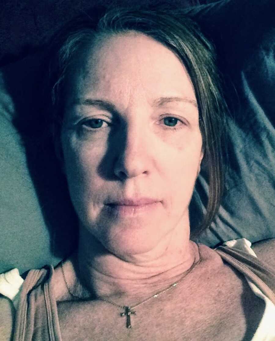 woman with lyme disease takes a selfie looking tired