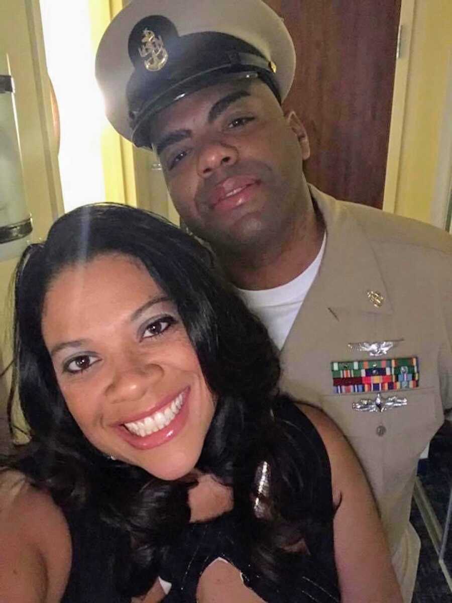 military couple takes a selfie, while husband is in uniform