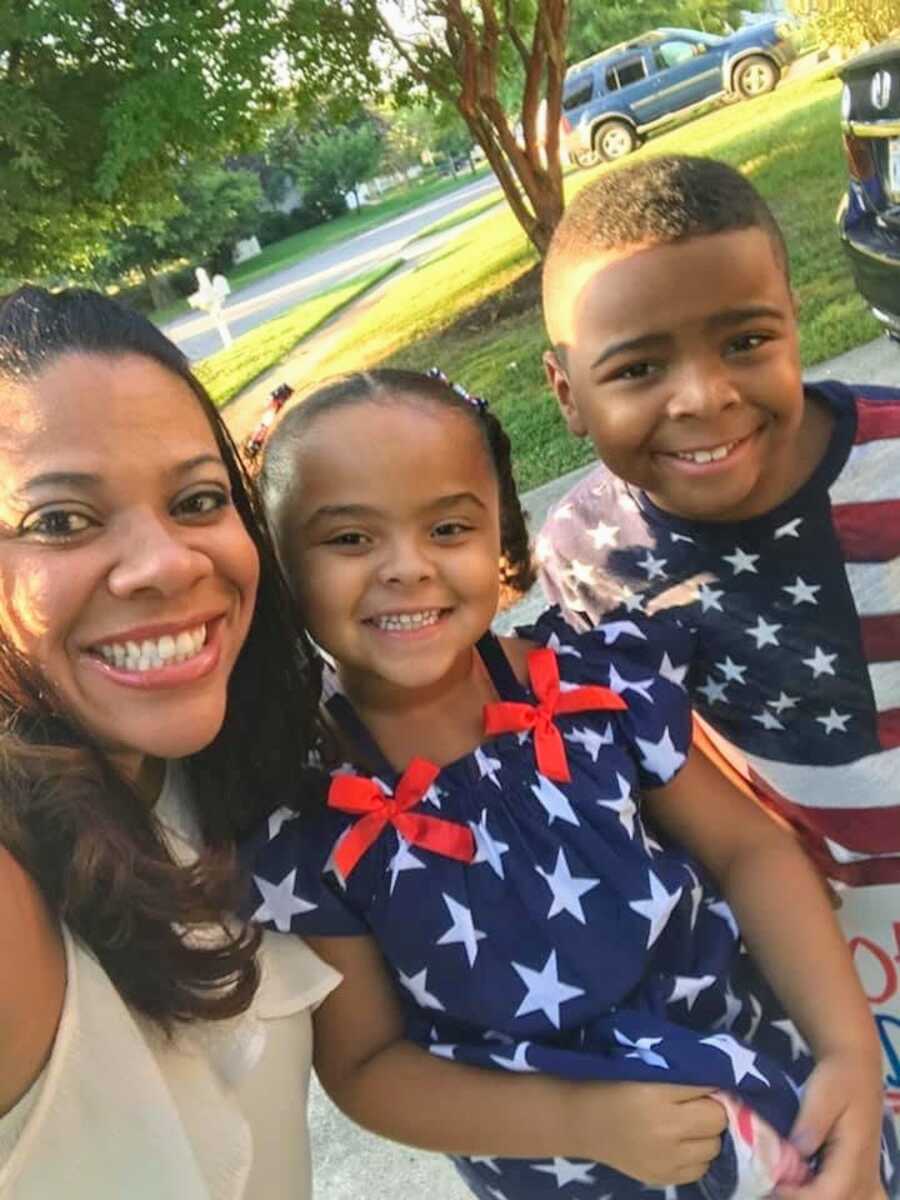 mother in military family takes a selfie with her two kids