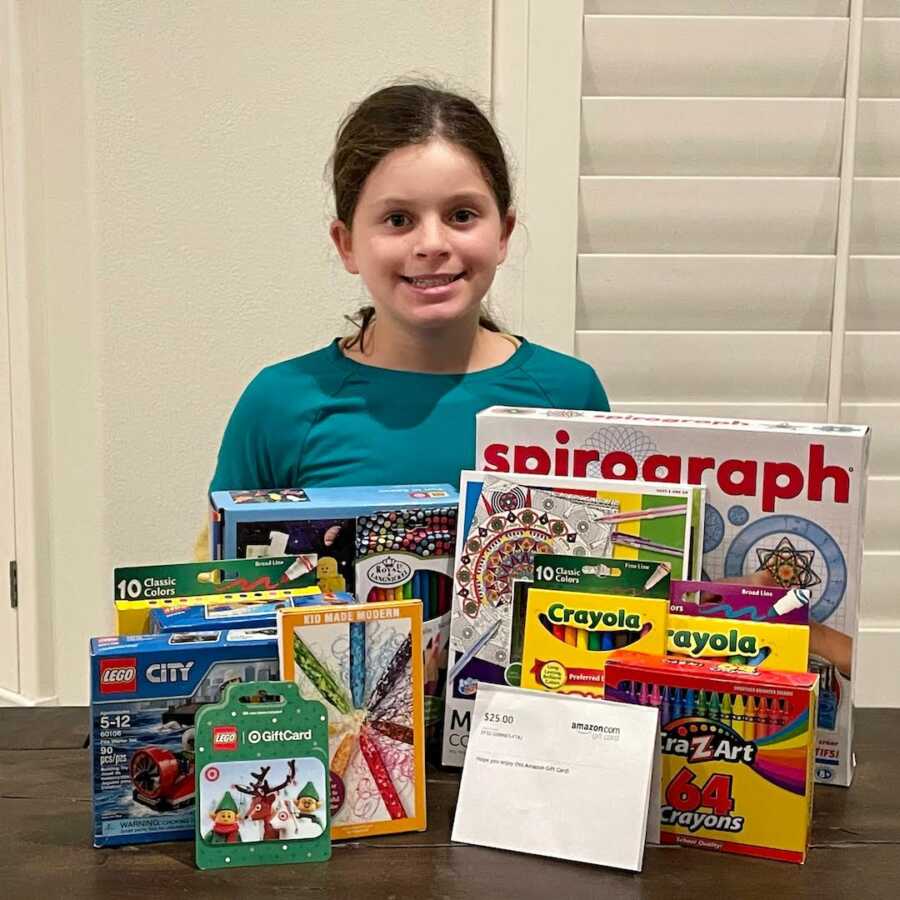 girl with games in front of her