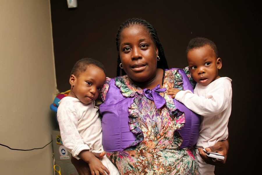 mother with twins on each arm 