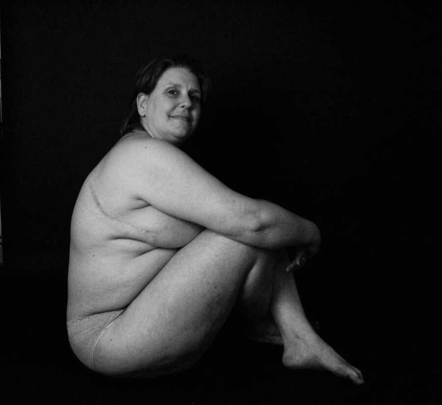 Black and white photo of nude woman 