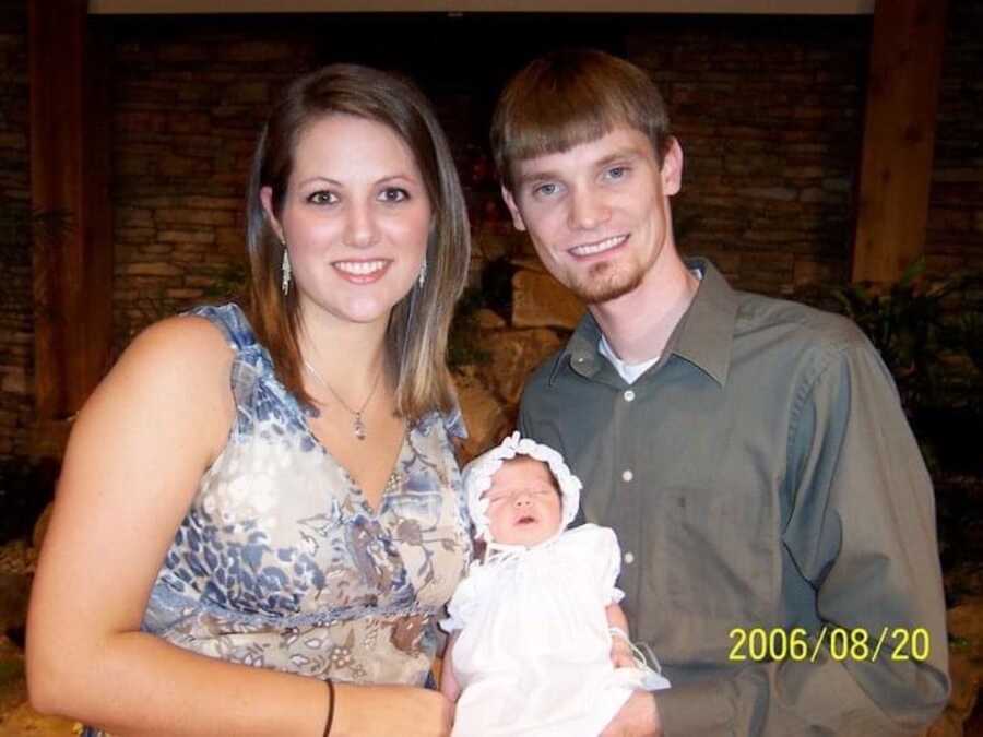 mother and father with newborn baby girl 