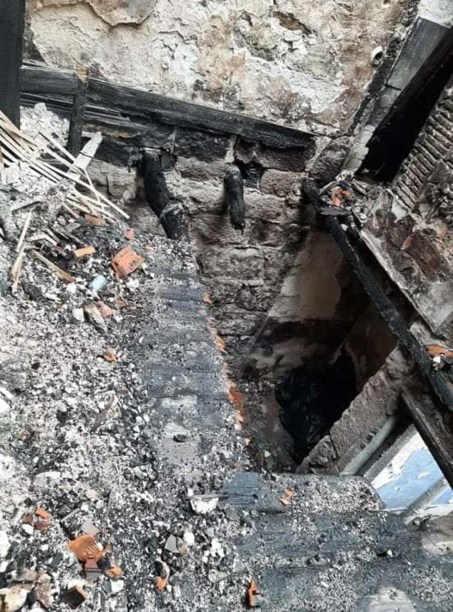 the ashes after people burned the house