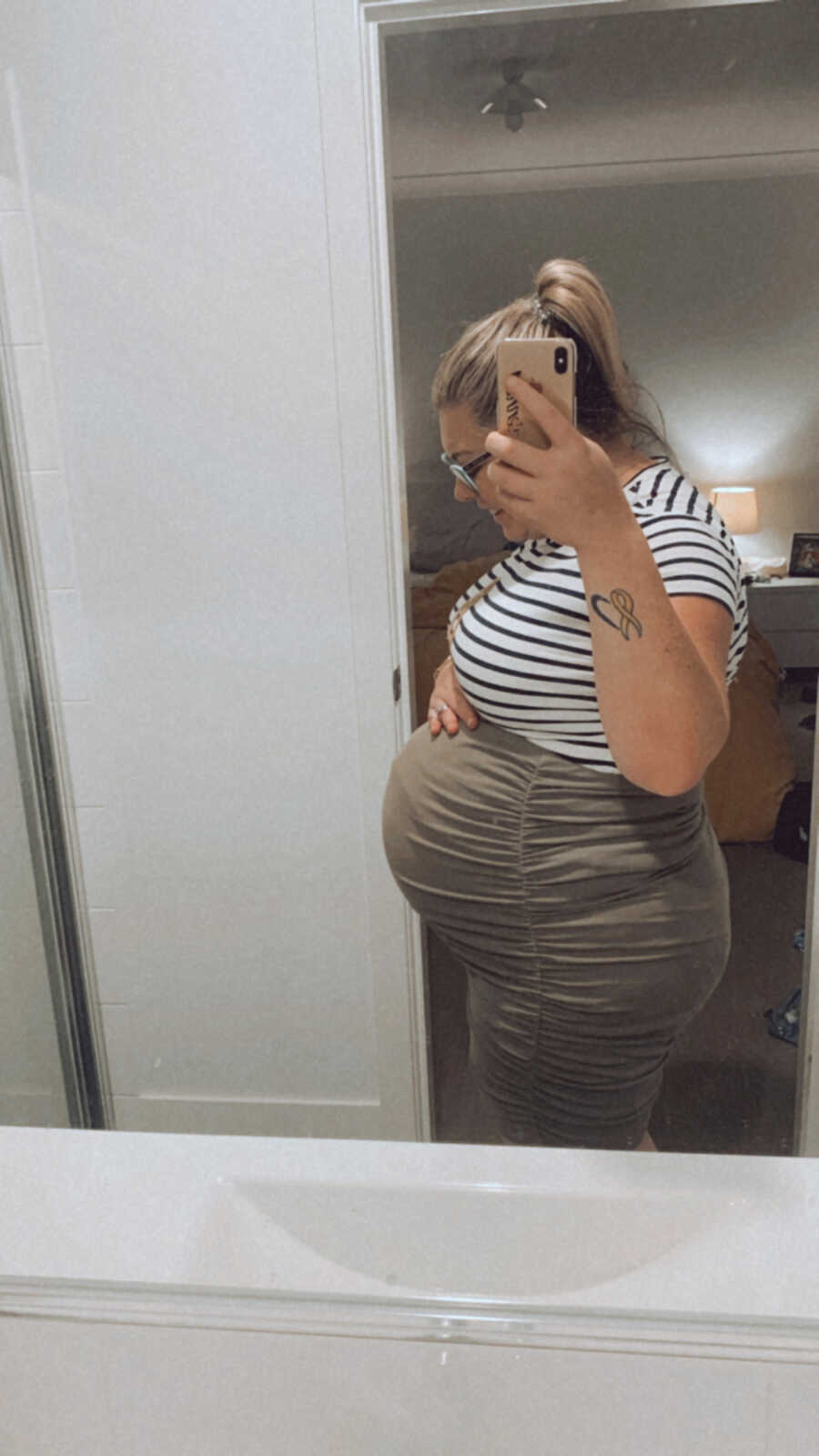 mom showing off her bump