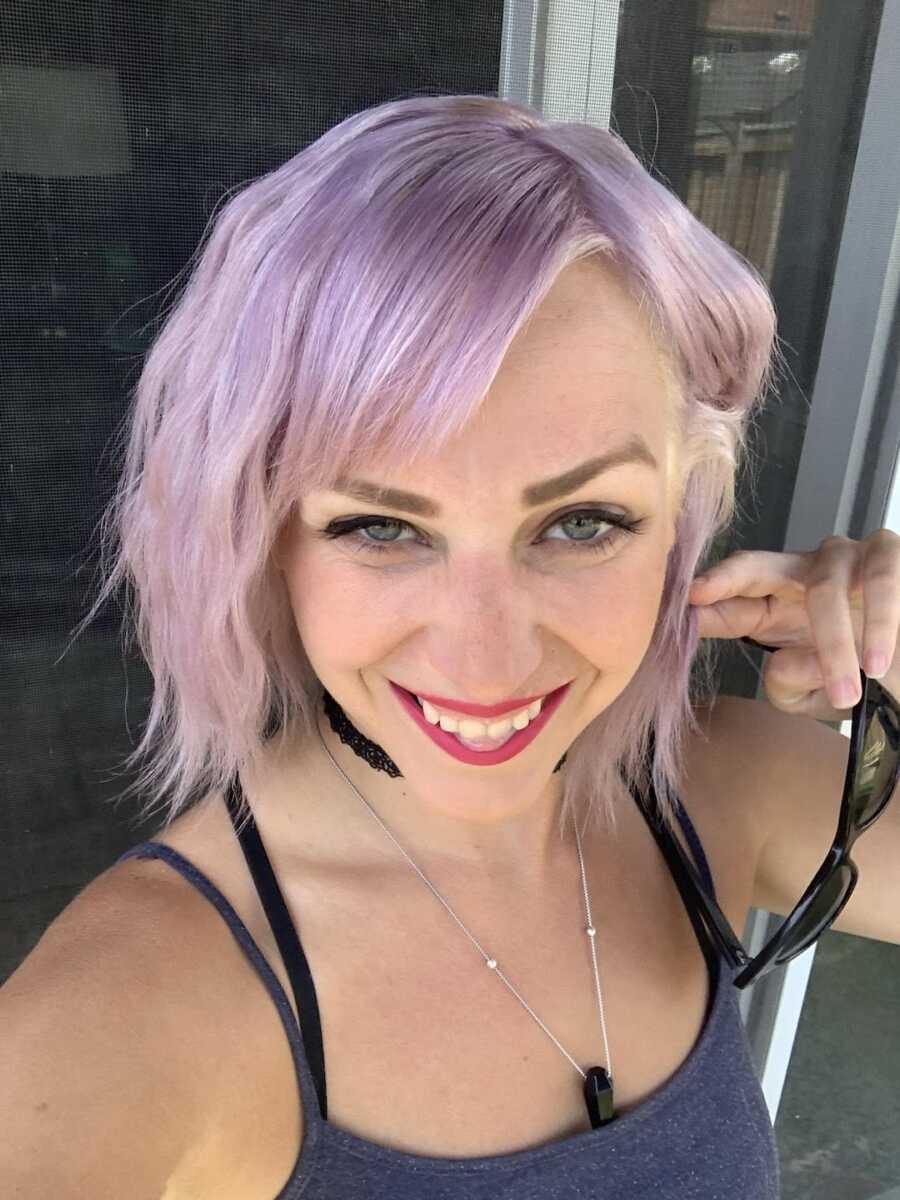 woman with purple hair taking selfie 