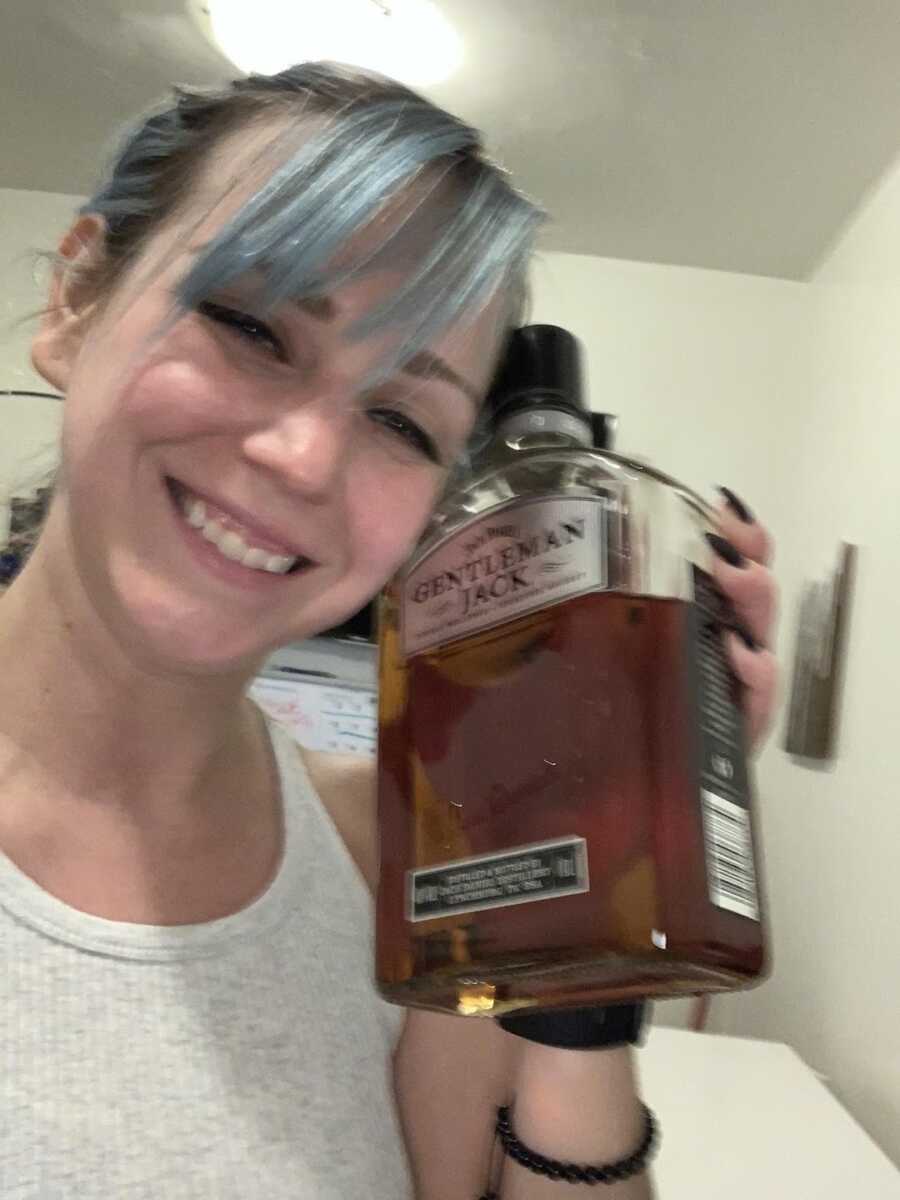 woman with a bottle of jack 