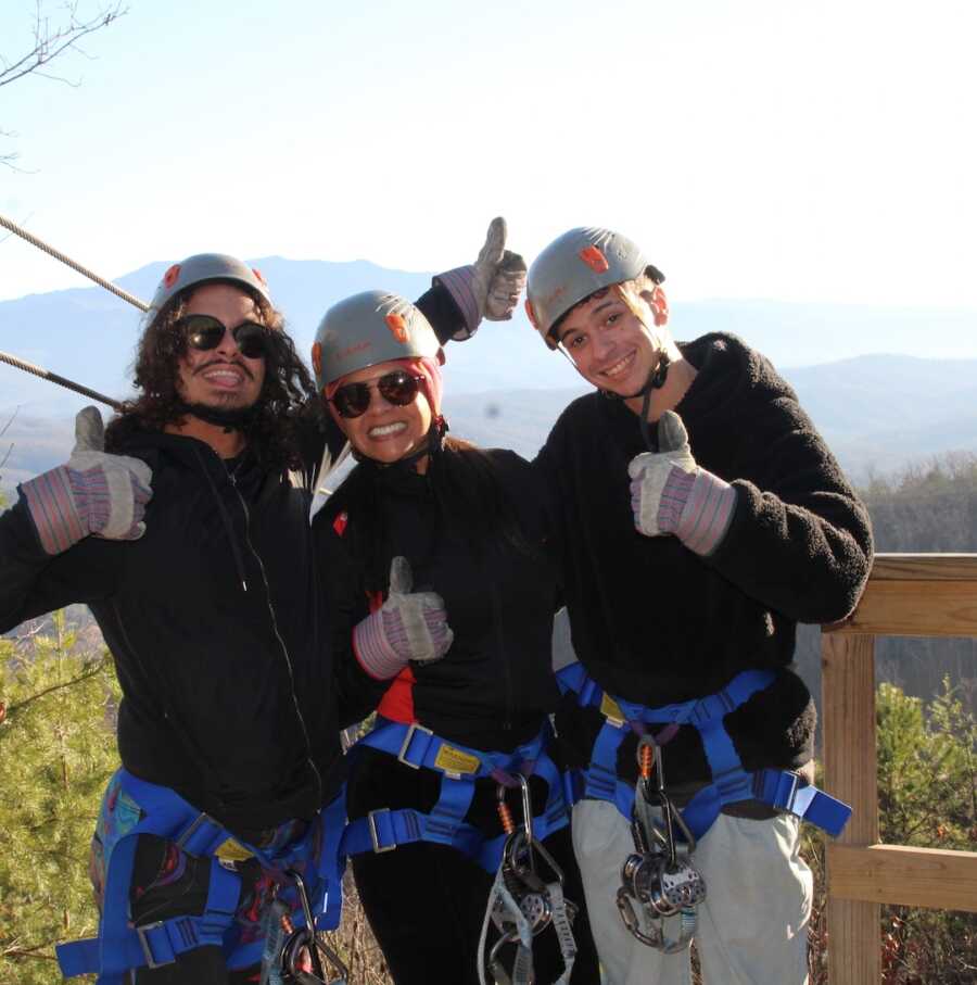 mother and sons ziplining 